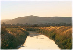 print of Crook Peak mirrored in Middle Rhyne.